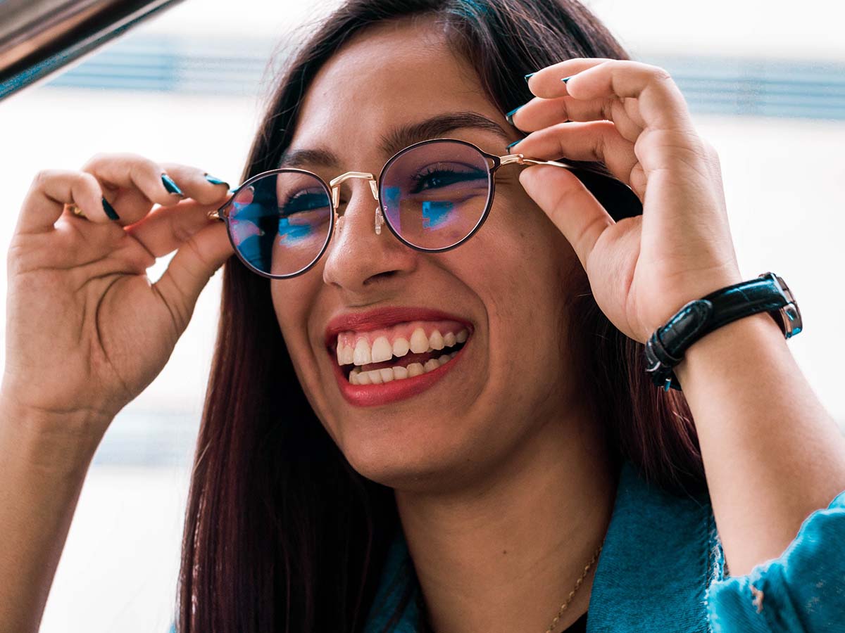 woman smiling with glasses on