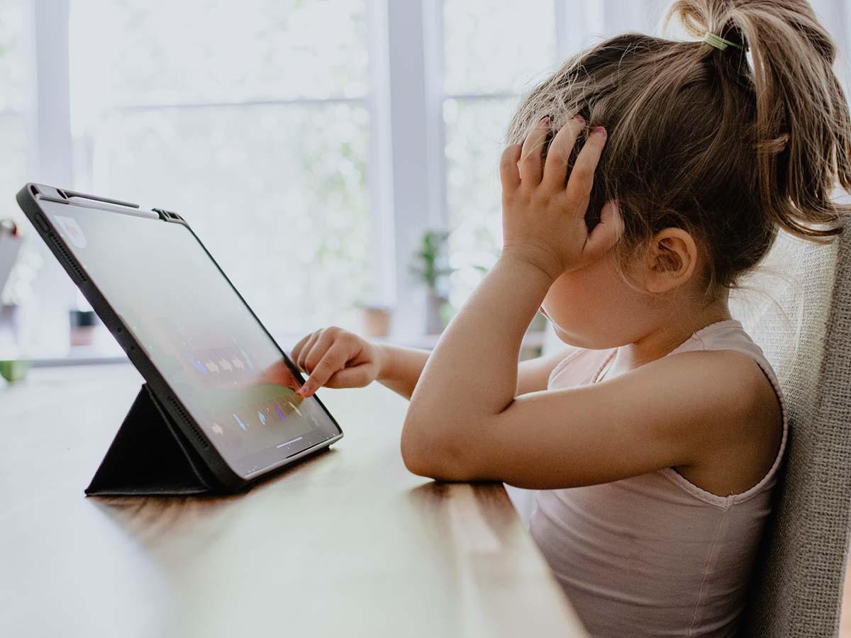 child playing on the ipad